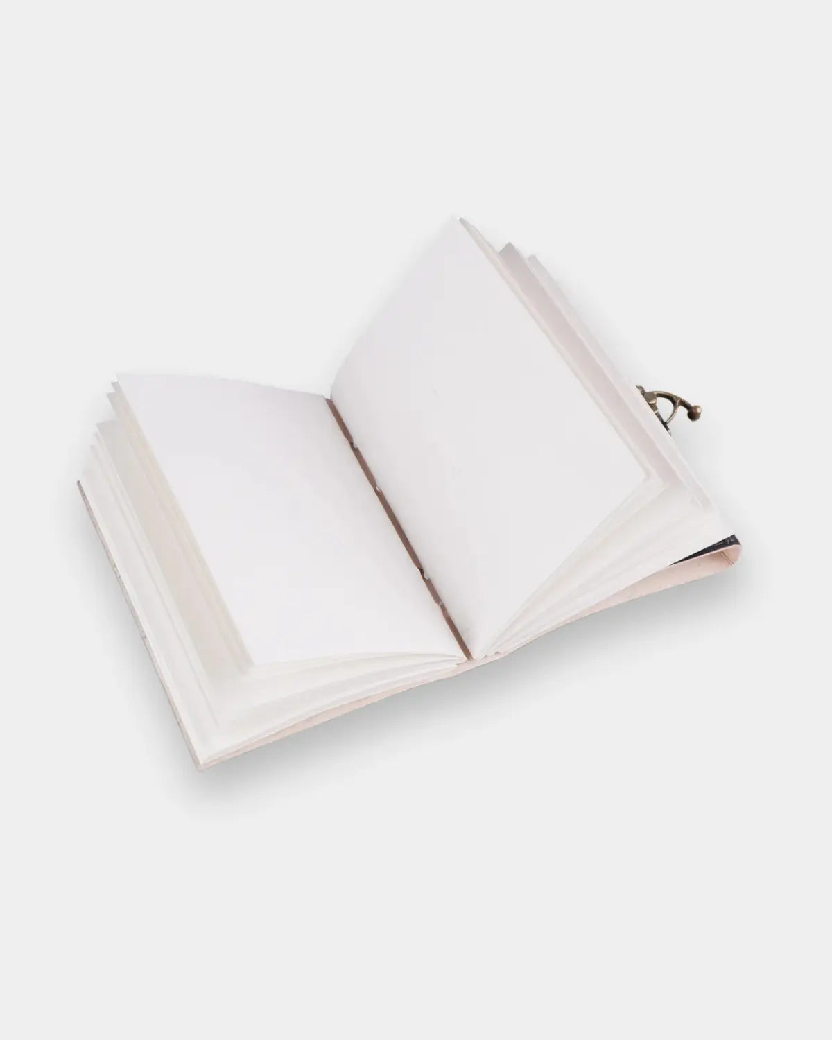 LAMAKHA handmade leather journal open flat showing cream blank handmade paper pages or deckle edge pages and antique brass locking clasp acid free fountain pen compatible paper