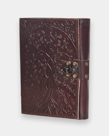 LAMAKHA brown leather journal angled view — Tree of Life leather journal embossed cover, quilted spine stitching, antique brass hook clasp, genuine handmade leather diary vintage notebook