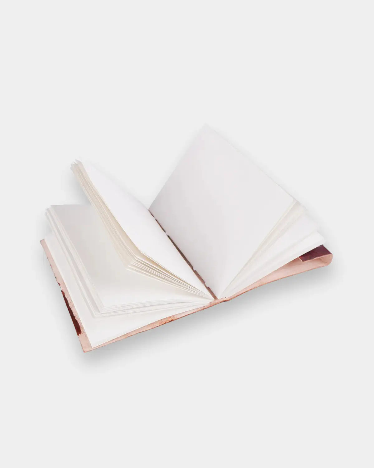 LAMAKHA handcrafted leather journal open flat showing white blank handmade paper pages — acid-free fountain pen-compatible leather sketchbook personalized leather journal