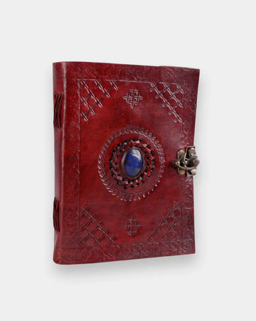 LAMAKHA handmade leather diary with lock angled view — red genuine leather journal notebook with lapis lazuli stone, silver clasp key, cross embossed cover, blank pages handmade leather journal